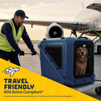 A golden retriever sits inside a durable hard-shell Petmate Basecamp Travel Kennel on a cart being pushed by an airport worker in front of a parked airplane.