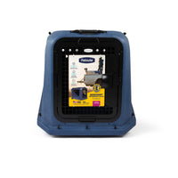 Blue plastic Petmate Basecamp Travel Kennel with a black metal grated door and an informational product label attached to the front.