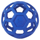 The JW Hol-ee Roller Dog Toy by Jw is a versatile puzzle dog toy featuring a blue rubber ball with a honeycomb pattern and hexagonal holes. The letters jw and a paw print design are embossed on its surface, crafted from natural rubber for durability and fun.