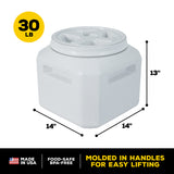 The Vittles Vault Outback Food Storage Container by Vittles Vault is a 13-inch-high, 14-inch-wide gray cube with a circular lid. It holds up to 30 lbs and is made in the USA from BPA-free materials. With molded handles and Gamma Seal Technology, it ensures airtight freshness.