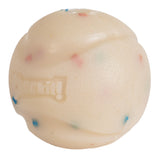 The Chuckit! Birthday Fetch Ball, made by Chuckit, is a natural rubber ball featuring a textured off-white surface with blue and pink specks. It has a wavy pattern with Chuckit! embossed on it and is compatible with Chuckit! Launchers for endless fun.
