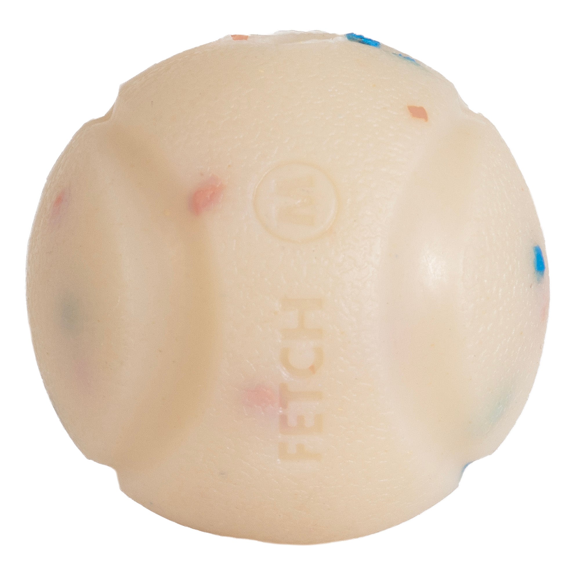 A close-up of the Chuckit! Birthday Fetch Ball reveals a textured off-white natural rubber design with raised grooves, colorful specks, and FETCH imprinted. Compatible with Chuckit! Launchers for endless fun.