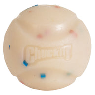 The Chuckit! Birthday Fetch Ball Medium by Chuckit! is a durable white natural rubber dog ball with textured grooves, small colored specks, and the raised Chuckit! logo on its surface.