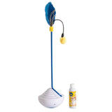 The JW Catnip Mister by Jw is a feather teaser cat toy with a tall blue wand featuring a feather and yellow pom-pom on top, mounted on a rounded white base, and comes with a small bottle of catnip oil solution beside the base.