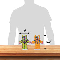 Two vibrant cat-shaped plush toys from Fatcat sit on a wooden surface: one green and one orange. The green toy measures 1 inch wide, while the orange toy is 3.5 inches tall. These FAT CAT Classic Kitten Little Cat Toys are infused with organic catnip, perfect for playful kittens.