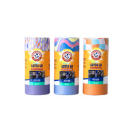 Three vibrant, cylindrical Arm And Hammer Gotta Go Waste Bag Dispensers, each featuring a unique patterned design and integrated waste bag dispenser for convenient access, are displayed side by side on a white background. These dispensers include fresh-scented waste bags that provide effective odor control, ensuring a more pleasant walk.