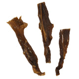 Three pieces of Wild Eats Water Buffalo Jerky, a product by Wild Eats, lie on a white background. The dried strips, in varying sizes and shapes, display the chewy texture typical of jerky.
