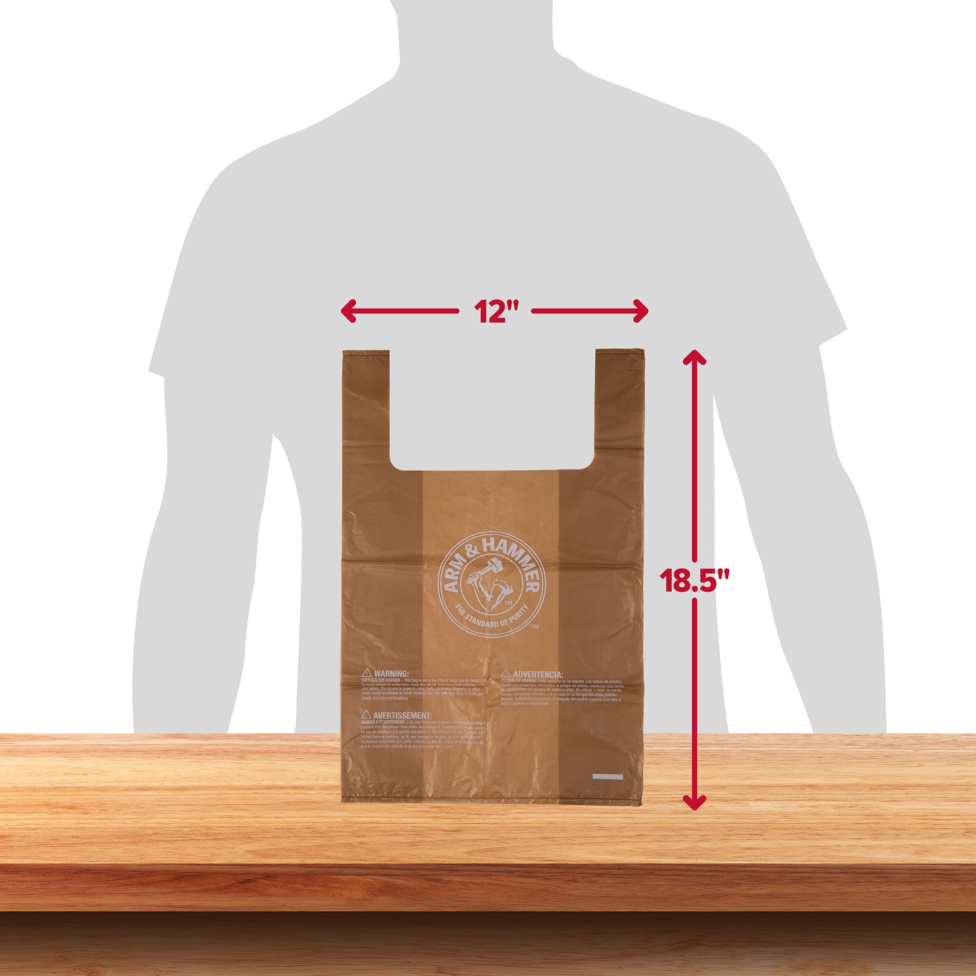 A brown plastic bag with the Arm And Hammer logo lies on a wooden surface. The Arm & Hammer Swivel Bin Pet Waste Bags measure 12 inches wide by 18.5 inches tall, ideal for pet waste disposal. A person’s silhouette in the background offers size comparison, underscoring its practicality and ease of use.