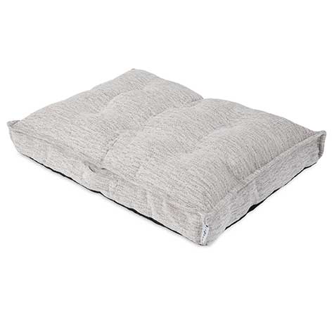 This light gray cushion, similar to a La-Z-Boy Salt & Pepper Cooper Mattress Dog Bed, has a textured fabric surface and plush feel. Its tufted in two sections with Comfort Select filling and features a small white tag, contrasting against the plain white background.