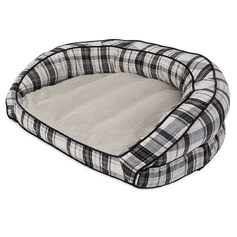 The La-Z-Boy Harper Sofa Dog Bed features a plaid design with raised sides and a black, white, and gray checkered pattern. Filled with Comfort Select fiber-fill for cozy rest, its machine washable and easily complements various home decors.