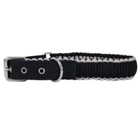 The Aspen Pet Paracord Dog Collar, crafted in black and white with a hand-braided design, includes a silver buckle and metal ring, ensuring its one of the most durable collars from Aspen Pet.