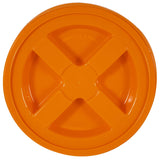 The Gamma2 GAMMA Seal Lid is an orange, round BPA-free HDPE plastic lid with an X-shaped design. It features embossed Open and Close labels with arrows for direction. This lid ensures an airtight seal to keep contents fresh.