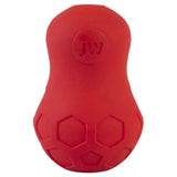 The JW Tumble Teez Dog Toy by Jw is a red, rubber puzzle toy with a peanut-like shape. It has embossed honeycomb patterns at the bottom and a jw logo with a paw print on top, offering treat dispensing fun.