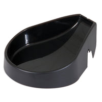 The Aspen Pet LeBistro Automatic Feeder Replacement Bowl is a black, kidney-shaped plastic container with a smooth, shiny surface and raised back edge. Its side notch ensures it fits seamlessly into the LeBistro system by Aspen Pet.