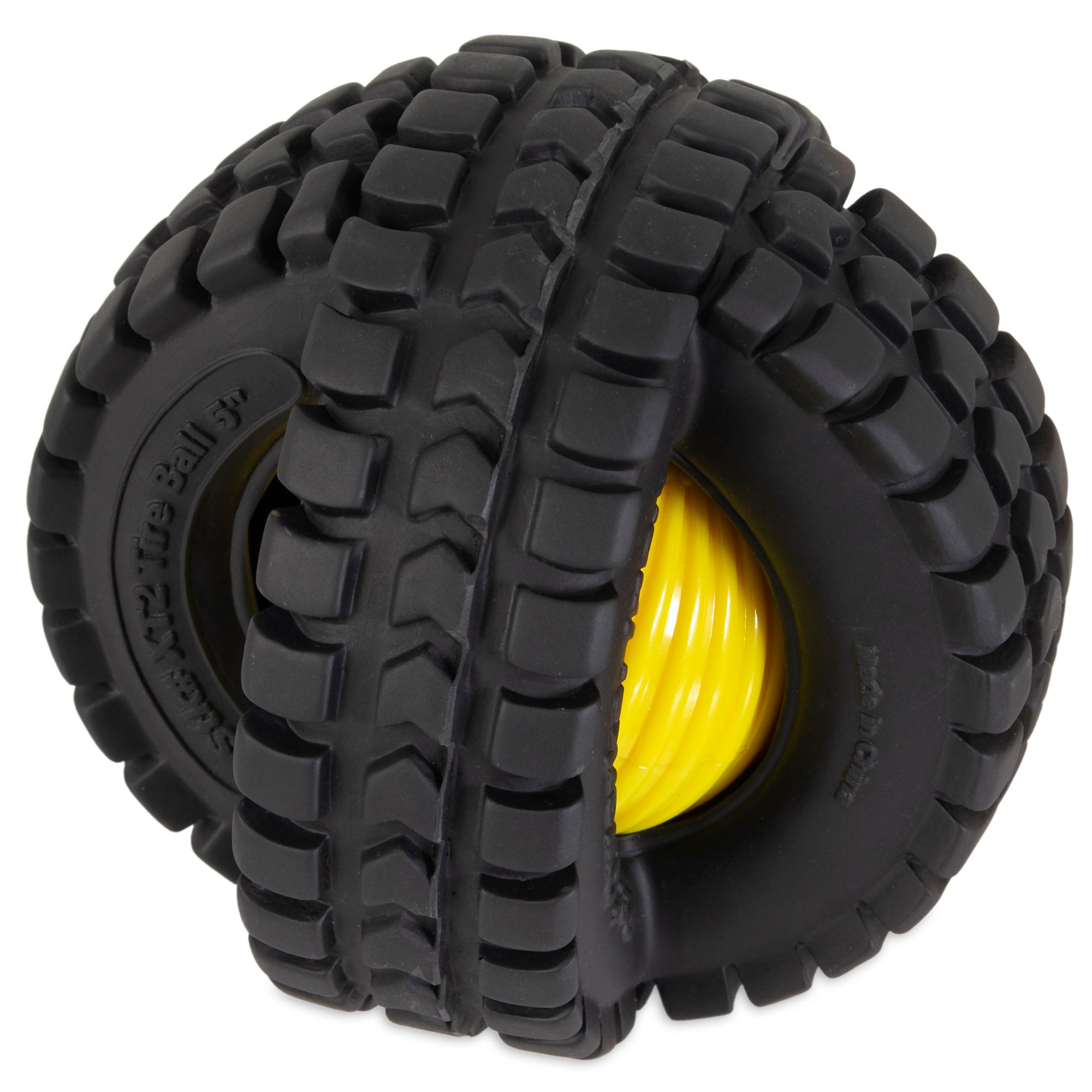 A close-up of a black, rugged rubber off-road tire with a bright yellow coil resembles the Pet Qwerks Animal Sounds X-Tire Ball by Petqwerks. The heavy tread pattern hints at durability and traction, with part of the yellow coil hidden within the tires deep grooves.