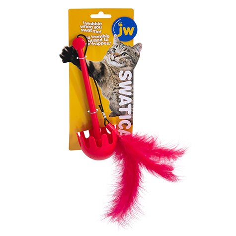 The JW Swatical Cat Toy by Jw includes a plastic wand with a red scoop and pink feathers. The package features a photo of a cat reaching up, labeled Swatical alongside the tagline I wobble when you swat me! in both English and French.