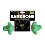 The packaging highlights the BarkBone Natural Instincts Mint Infused Stick Nylon Dog Chew, featuring a mint flavor to entice your dog. Made by Barkbone Natural Instincts in the USA, this light green bone-shaped toy is crafted from durable nylon.