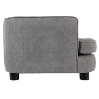 A side view of a gray upholstered armchair with minimalist design, crafted from quality materials. It features soft cushioning, a straight backrest, and two cylindrical black legs. The fabrics texture resembles fine furnishings like the La-Z-Boy Bartlett Sofa Dog Bed by La-Z-Boy.