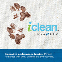 The La-Z-Boy Duchess Fold Out Sleeper Sofa Dog Bed is covered in textured white iClean fabric with brown mud paw prints and features the text iclean by La-Z-Boy in green and blue. A blue banner highlights its innovative performance, perfect for homes with pets, children, and daily use.