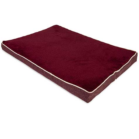 The Aspen Pet Burgundy Orthopedic Pet Bed is a luxurious rectangular pet bed crafted from plush micro-lux fabric in burgundy, featuring light-colored piping. Its mattress-like foam offers thick orthopedic support, ensuring exceptional comfort for your pet.
