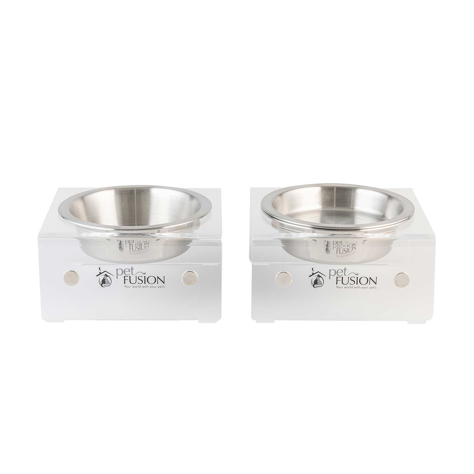 PetFusion Elevated Bowls For Dogs & Cats feature two stainless steel bowls set in clear acrylic stands with a cut-out pet FUSION logo. This design promotes healthier digestion and suits multi-pet households, offering an elevated feeding experience on a white background.