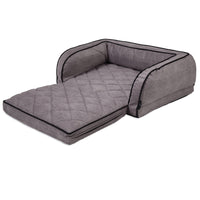 The La-Z-Boy Duchess Fold Out Sleeper Sofa Dog Bed features a gray quilted design with raised bolsters and extended cushioned front. Made with iClean fabric for easy maintenance, its textured material and black piping ensure durability and style, offering ultimate pet comfort and lounging.