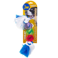 The JW Treat Pods Rope Dog Toy packaging highlights its interactive design with a chew toy featuring a rope and three colorful pods in purple, green, and red. It displays a joyful dog and the JW logo, with tassels on the rope ends. English and French text suggest filling pods with treats for extra fun.
