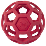 The JW Hol-ee Roller Dog Toy by Jw features a hexagonal lattice design made from natural red rubber, adorned with a circular jw center, providing the perfect puzzle to keep your pet entertained.
