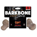 The BarkBone Natural Instincts Bacon-Infused Dinosaur Nylon Dog Chew packaging showcases a dog and sizzling bacon, featuring the text For Tough Chewers and USA, alongside its unique dinosaur logo.