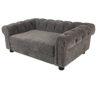The La-Z-Boy Newton Sofa Dog Bed is a gray, plush pet sofa designed like a miniature sofa with tufted back and armrests. It features decorative nailhead trim, short black legs, and textured chenille wrap for added elegance.