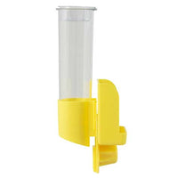 The JW Clean Seed Silo Bird Feeder by Jw is a transparent, cylindrical water bottle with a yellow plastic base and holder. It attaches to birdcages, functioning as a gravity feeder for easy drinking by caged birds.