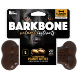The Barkbone Natural Instincts Peanut Butter Flavorit Nylon Dog Chew packaging showcases a black dogs face, emphasizing natural instincts. Made in the USA, this bone-shaped toy offers an allergen-free peanut butter flavor and promises a long-lasting chew for your furry friend.