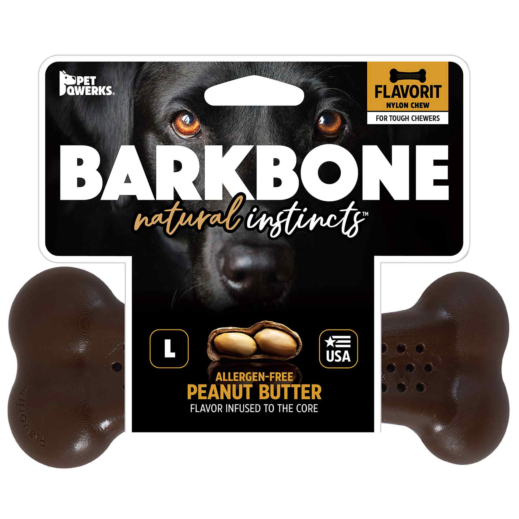 The Barkbone Natural Instincts Peanut Butter Flavorit Nylon Dog Chew packaging showcases a black dogs face, emphasizing natural instincts. Made in the USA, this bone-shaped toy offers an allergen-free peanut butter flavor and promises a long-lasting chew for your furry friend.