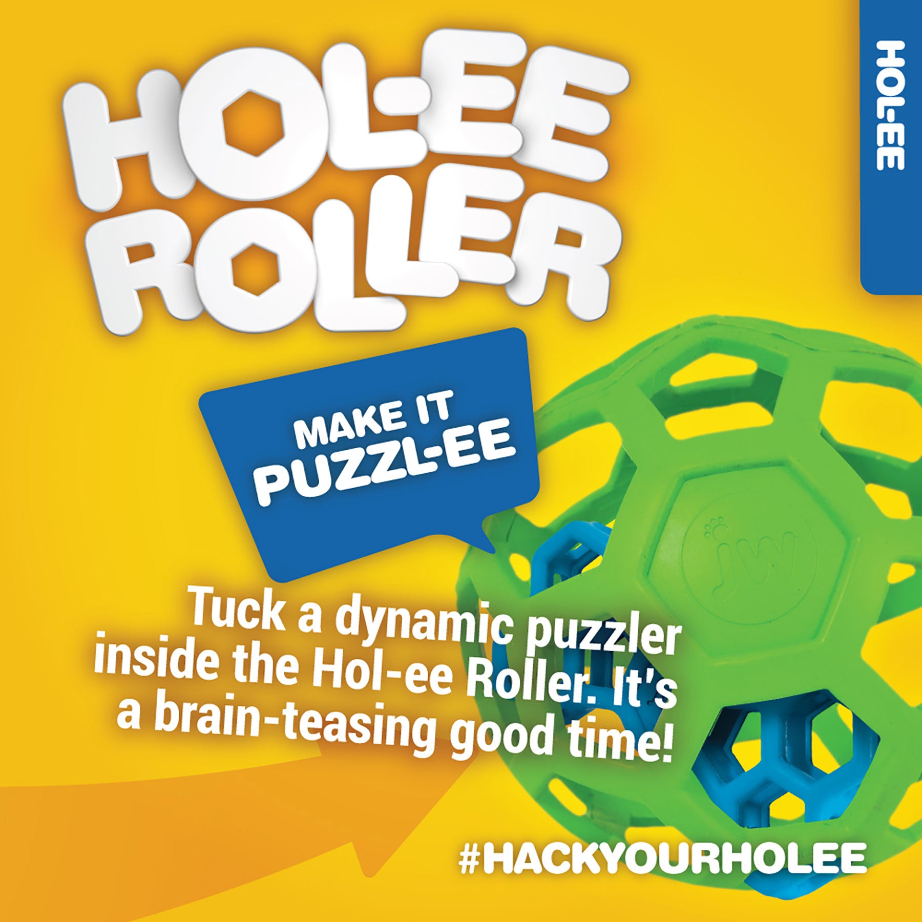 Bright ad for JW Hol-ee Roller Dog Toy: Features a natural rubber green hexagonal ball with a blue sphere puzzle inside. Text reads: Make it Puzzl-ee. Tuck a puzzler into the versatile Hol-ee Roller for brain-teasing fun! #HackYourHolee. Brand: JW.