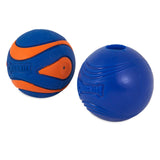 Two blue and orange rubber dog balls from the Chuckit Sonic Fetch Pack feature brand logos. The left ball has an orange curved pattern, while the right one is solid blue with grooves and an emblem.