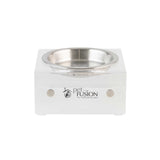 The PetFusion Elevated Bowls For Dogs & Cats feature a clear, acrylic stand with a stainless steel bowl, ideal for multi-pet homes. Its rectangular design with two round knobs promotes healthy digestion, elegantly resting on a plain white backdrop.