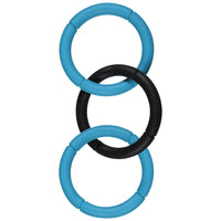 The JW Invincible Chains Dog Toy by Jw features three vertically interlocking rings, with the top and bottom in blue and the middle in black. Its smooth, segmented design forms a durable abstract chain pattern, perfect for interactive dog play, ensuring endless fun.