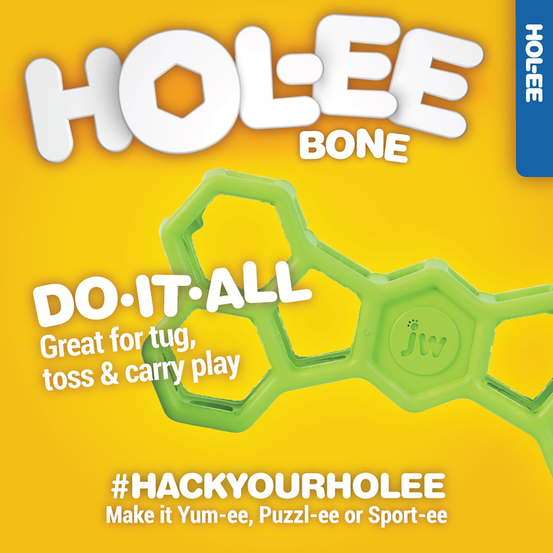 A vibrant yellow ad features the JW Hol-ee Bone Puzzle Dog Toy, a green dog chew with hexagonal holes. Made by Jw from natural rubber, its ideal for tug, toss, and carry play. Fun hashtag suggestions include #HackYourHolee: Make it Yum-ee, Puzzl-ee or Sport-ee.