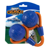 The Chuckit! Crunch Duo Tug Dog Toy packaging has innovative Super Crunch Balls: two blue rubber balls linked by an orange rope, with a fluffy white dog happily playing in a grassy field while holding the toy.
