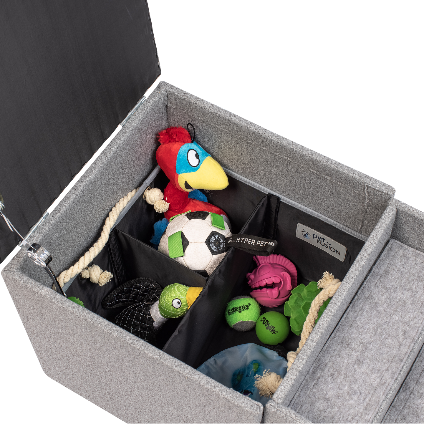 The PetFusion Multi-Purpose Pet Stairs, by Pet Fusion, serve as a premium gray storage ottoman filled with colorful pet toys like a plush parrot and soccer ball. Its thoughtfully sectioned interior offers an organized, multi-functional solution for play and tidy living.