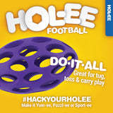 A vibrant purple JW Hol-ee Football Dog Toy with a lattice design rests on a bright yellow backdrop. The text says Do It All: Great for tug, toss & carry play and #HackYourHolee: Make it Yum-ee, Puzzl-ee or Sport-ee, making it perfect as a durable dog toy and creative treat ball!.