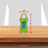 The Arm & Hammer Bone Dispenser & Disposable Waste Bag Set, designed in green and shaped like a bone, measures 1.8 wide by 4 tall with a blue bag roll that controls odors. It features a top clip and is displayed on wood against a gray backdrop. Note: Colors may vary.