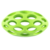 The JW Hol-ee Football Dog Toy by Jw is a durable green rubber toy shaped like a hollow sphere with lattice-like circular cutouts, perfect for dogs.