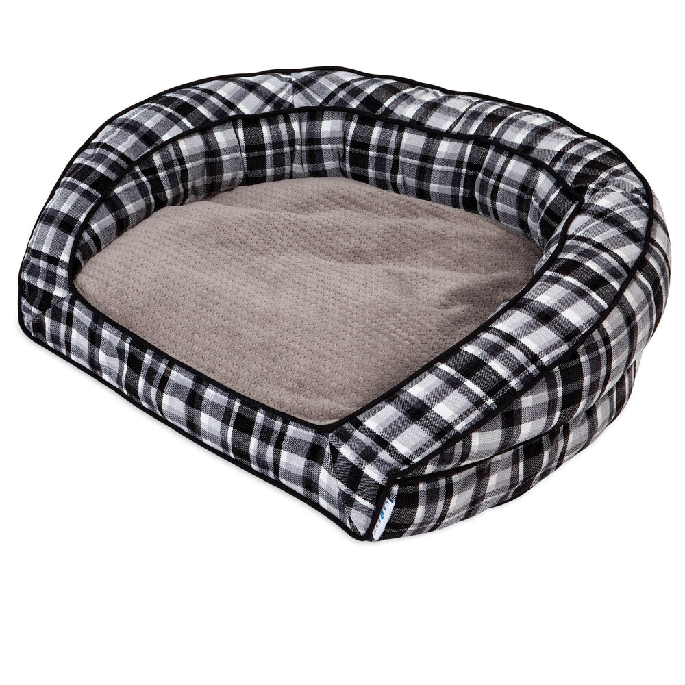 The La-Z-Boy Spencer Plaid Tucker Sofa Dog Bed, ideal for medium dogs, boasts a cozy black and white plaid design with raised edges and a soft, light brown cushioned interior for exceptional comfort.